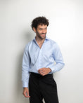 Load image into Gallery viewer, Man wearing a light blue stripes dress shirt and black pants 

